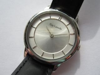 Guy Laroche round N.O.S silver dial ladies watch runs and keeps time