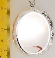 WBM large oval locket, engraved, clear glass bead
