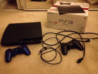 Playstation 3 Slim Charcoal Black With 2 Wireless Controllers And 1 
