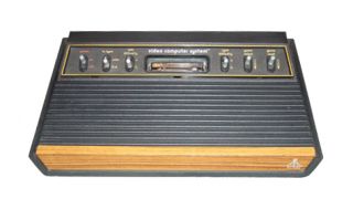 Atari 2600 Woodgrain Console (NTSC), power cord, joysticks, games