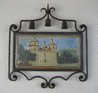 spanish style santa barbara mission tile in wrought iron frame