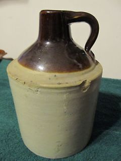 OLD CROCK WHISKEY JUG WITH FINGER HOLD HANDLE ONE QUART SIZE