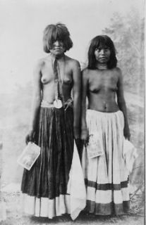 1909 photo Two bare breasted Yuma women posed, standing, full length 