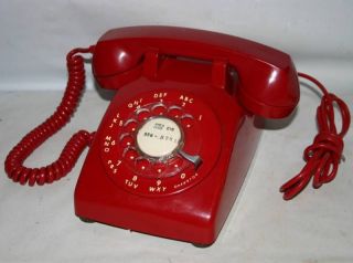 red rotary phone in Telephones