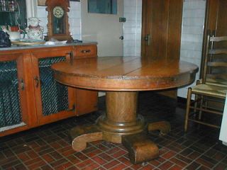 SOLID OAK 48 PEDESTAL TABLE. VERY DRAMATIC AND HEAVY PIECE.