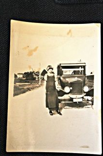 1920 photo Auto with a flapper hand crank ready 1920 fashions shoes