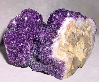 This unique Amethyst crystal geode has a curvy freeform shape with a 