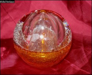 Offered to you is this vintage spheric amber crystal glass paperweight 