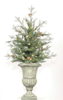 This artificial Christmas tree has been potted in a distressed garden 