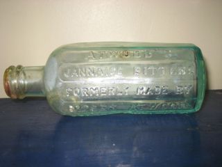 Antique ATWOODS Jannaice BITTERS Bottle Green Glass Crooked Slanted 