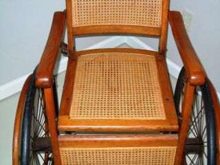 Antique Early 1900s Wheelchair Wicker Caned Seat Back Oak 3 Wheel 