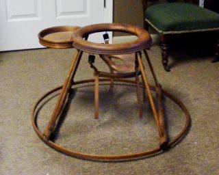 old 1800s brown wooden baby seat walker