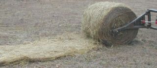 store hay bale unroller for skid steer for round bales