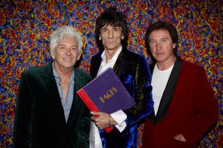   published by the band and features original text by ronnie wood ian