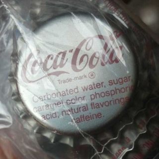 50 silver cocacola new and unused bottle caps time left