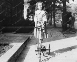 young girl riding antique tricycle 1920 vintage 8x10 reprint of