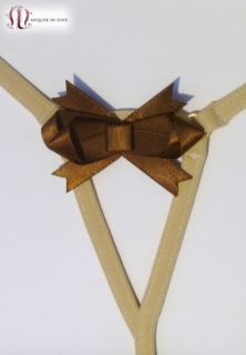 The back features a sexy mocca satin bow over a revealing opening.
