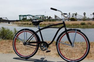   black beach cruiser bike, red rims, fenders, single speed bicycle coas