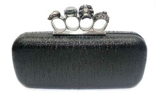 selling a stylish *Black* Brass Knuckle purse, with a jeweled 