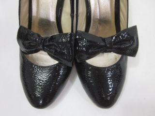you are bidding on a pair of colin davis black patent leather bow