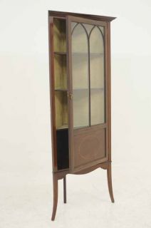 Edwardian mahogany corner cabinet, the projected moulded cornice over
