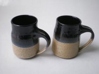 Pair of hand thrown mugs signed Doran 76. 2 3/4 diameter at mouth