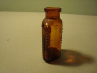 rare antique eli lilly amber poison bottle