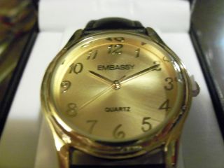 NEW IN BOX EMBASSY QUARTZ WATCH GOLD CASE WITH ADJUSTABLE BLACK