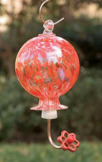 red hand blown round glass hummingbird feeder