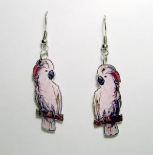 These handcrafted dangle earrings features Moluccan Cockatoo Parrots