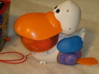 fisher price go baby go pull n pop pelican musical n silly sounds cute