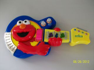 TWO FISHER PRICE SESAME STREET JAM WITH ELMO GUITAR and TOY STROLLER