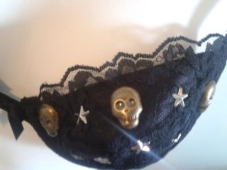 This new black bra has been hand decorated. The cups are covered in