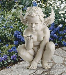 curious cherub angel statue garden winged sculpture