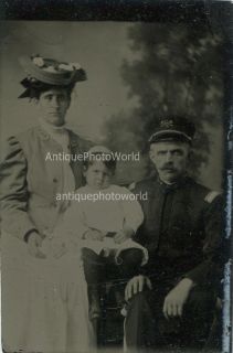 Fireman firefighter in uniform with family antique tintype photo
