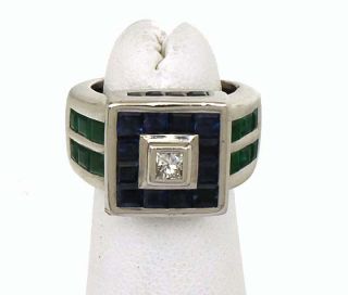 this is a hefty 18k gold diamond sapphires and emeralds ladies band
