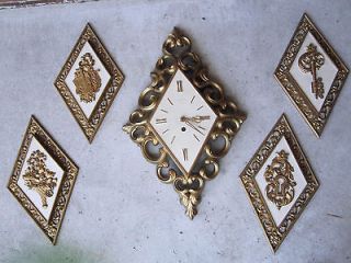 VINTAGE LARGE SYROCO WALL HANGING CLOCK WITH FOUR WALL HANGING PLAQUES