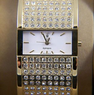 LADIES GOLD TONE CUBIC ZIRCONIA BRACELET WATCH WITH WHITE DIAL