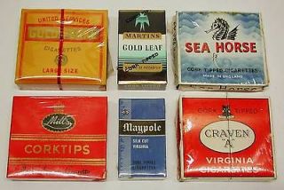 unopened packets of vintage cigarettes   1960s era   CRAVEN A; MAYPOLE