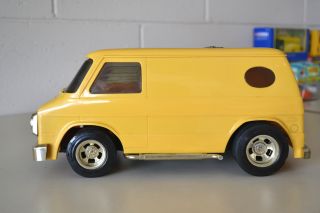 Powered Vintage 1970s Yellow Chevy Van with Gold Rims Muffler Bumpers