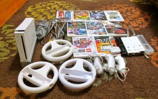 WII Console 12 Games 4 Remotes covers 3 wheels 3 Nunchucks 