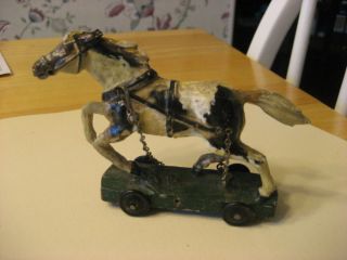  EARLY 1900S COMPOSITION SMALL PULL TOY HORSE ON WHEELS WITH 4 WHEELS