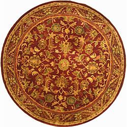 Handmade Exquisite Wine/ Gold Wool Rug (8 Round) (RedPattern OrientalMeasures 0.625 inch thickTip We recommend the use of a non skid pad to keep the rug in place on smooth surfaces.All rug sizes are approximate. Due to the difference of monitor colors, 